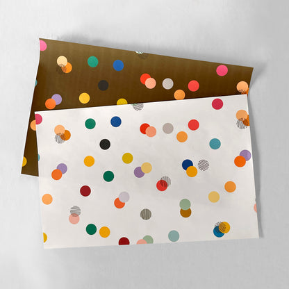 Colorful polka dot pattern placemat set on a white background