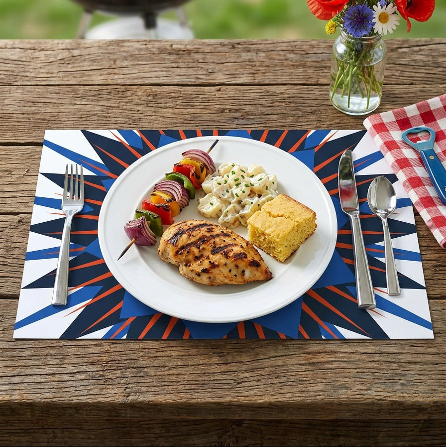 Outdoor setting with a plate of food, flowers, and barbecue grill.