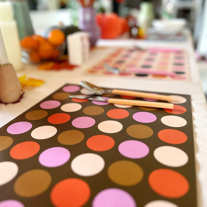 Colorful polka dot pattern on a paper placemat