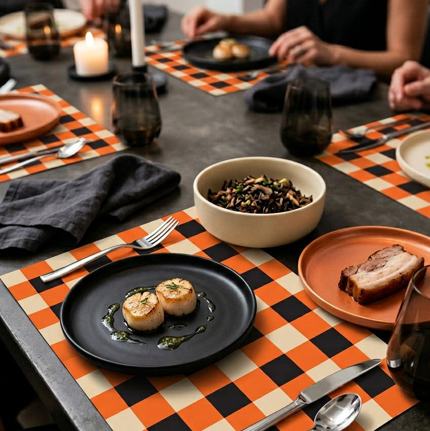 Plaid paper placemat on a modern table set for dinner. 