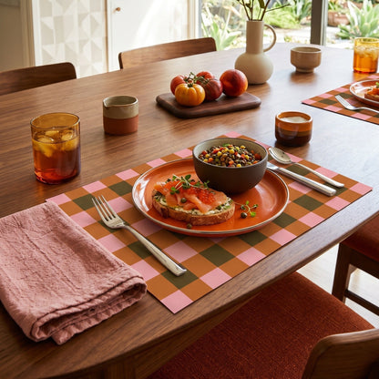 Plaid paper placemat on a modern table set for dinner. 