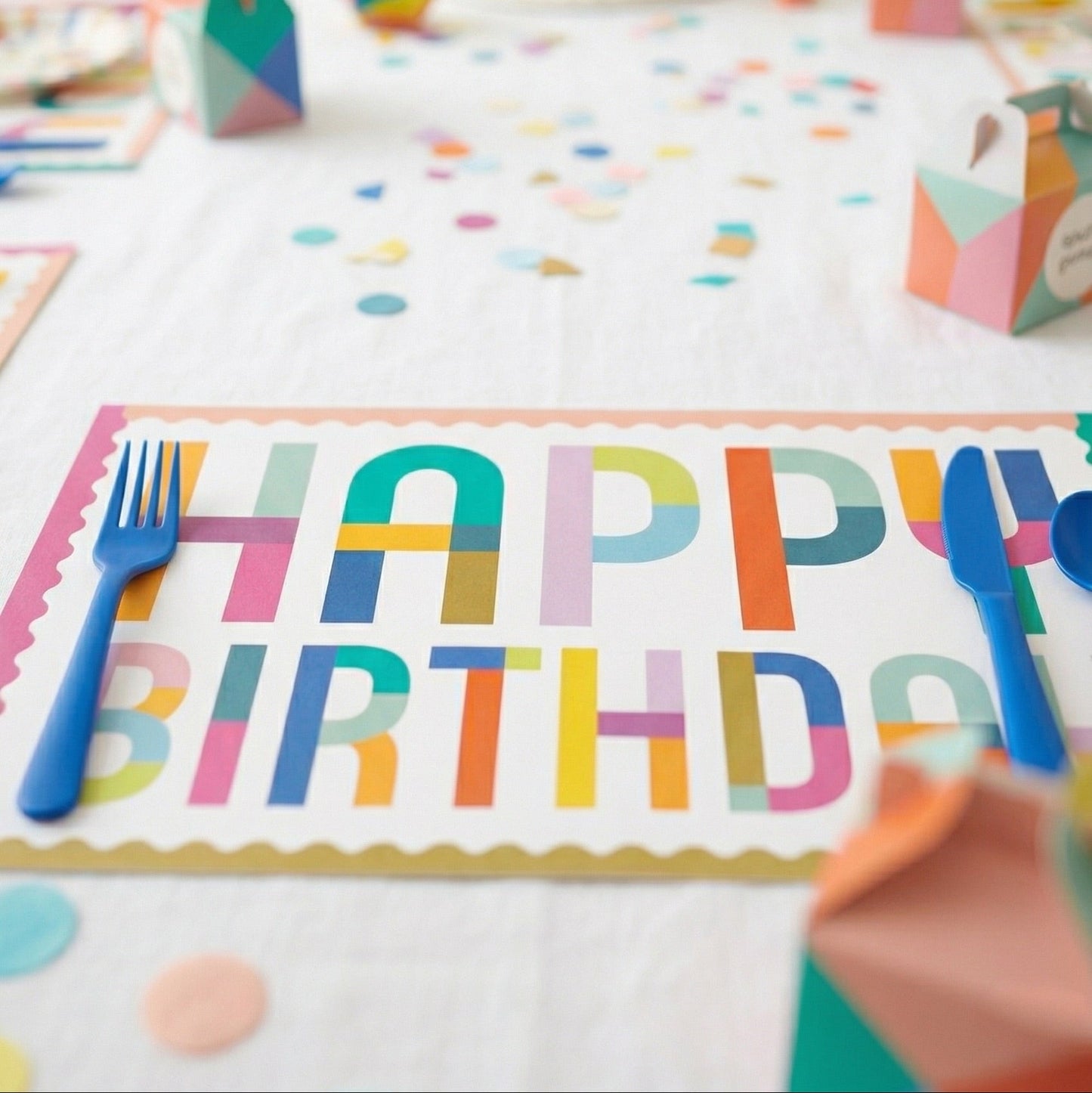 Happy Birthday paper placemat on a table. 