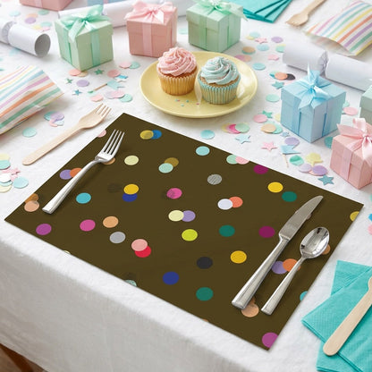 Brown paper placemat with colorful polka dots and cupcakes and presents for a birthday party. 