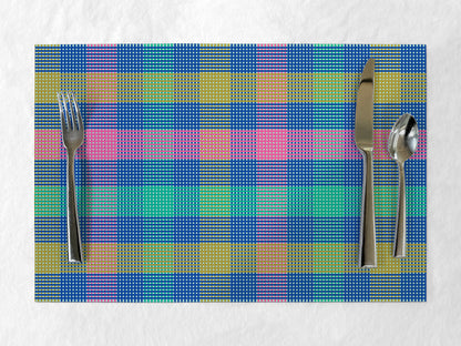 Colorful plaid paper placemat with silverware on a white background