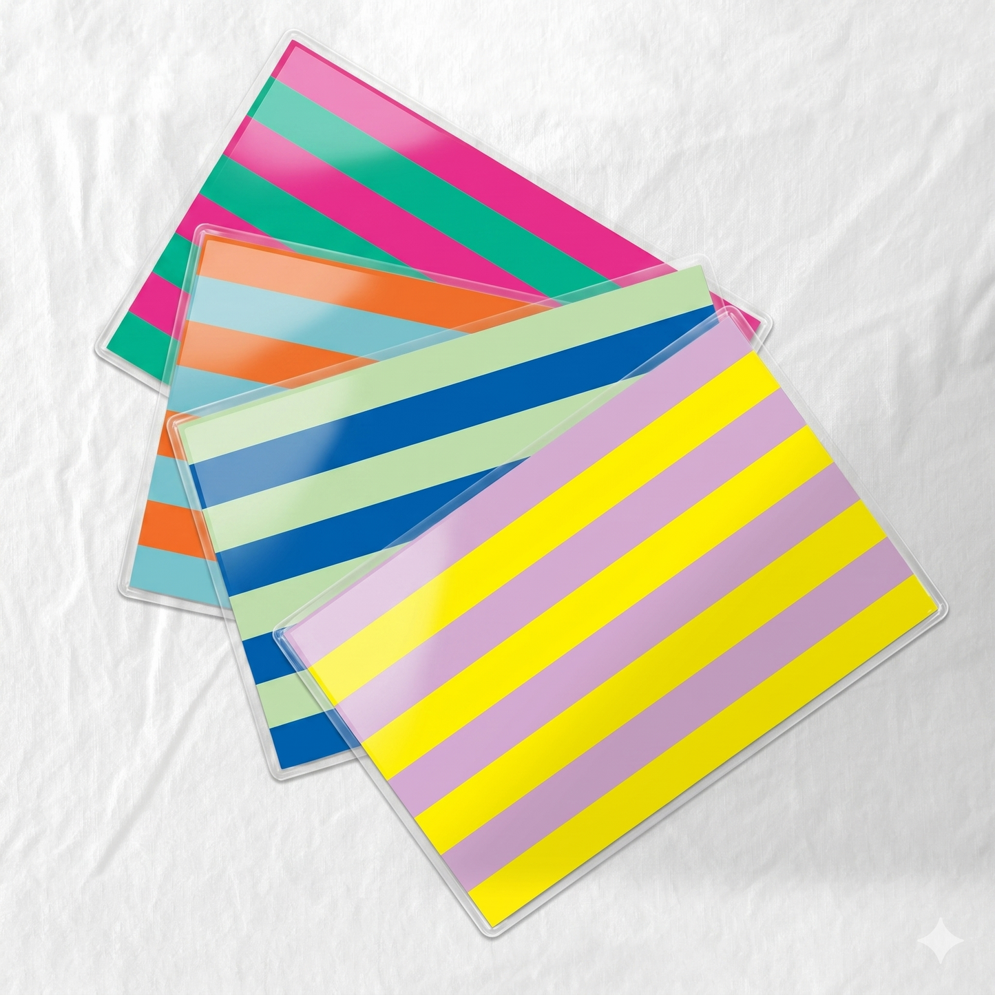 Colorful striped paper laminated placemats on a white background