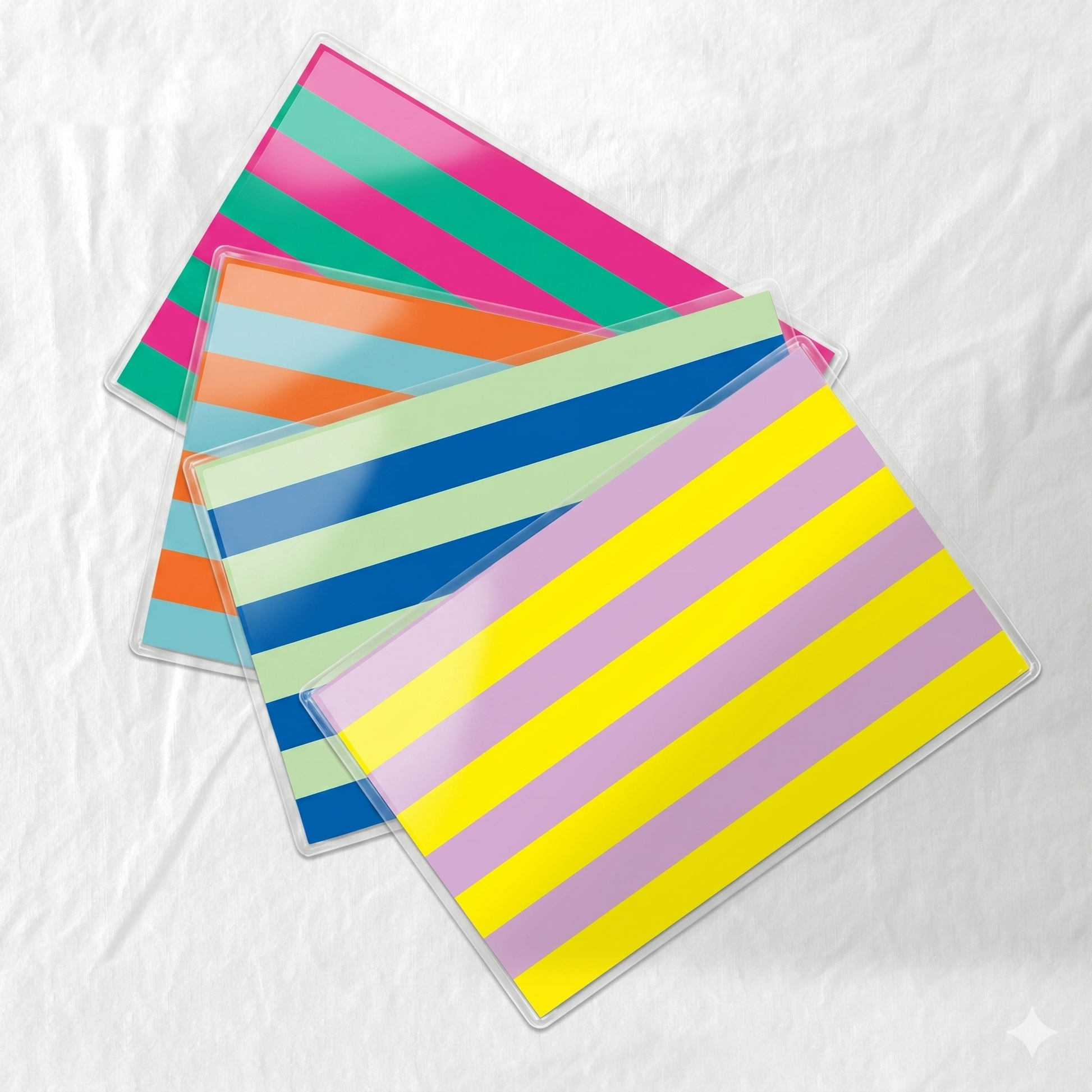 Colorful striped paper laminated placemats on a white background