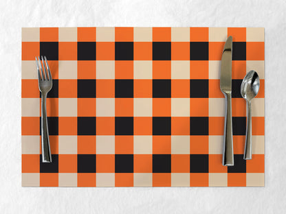 Checkered placemat with cutlery on a white background