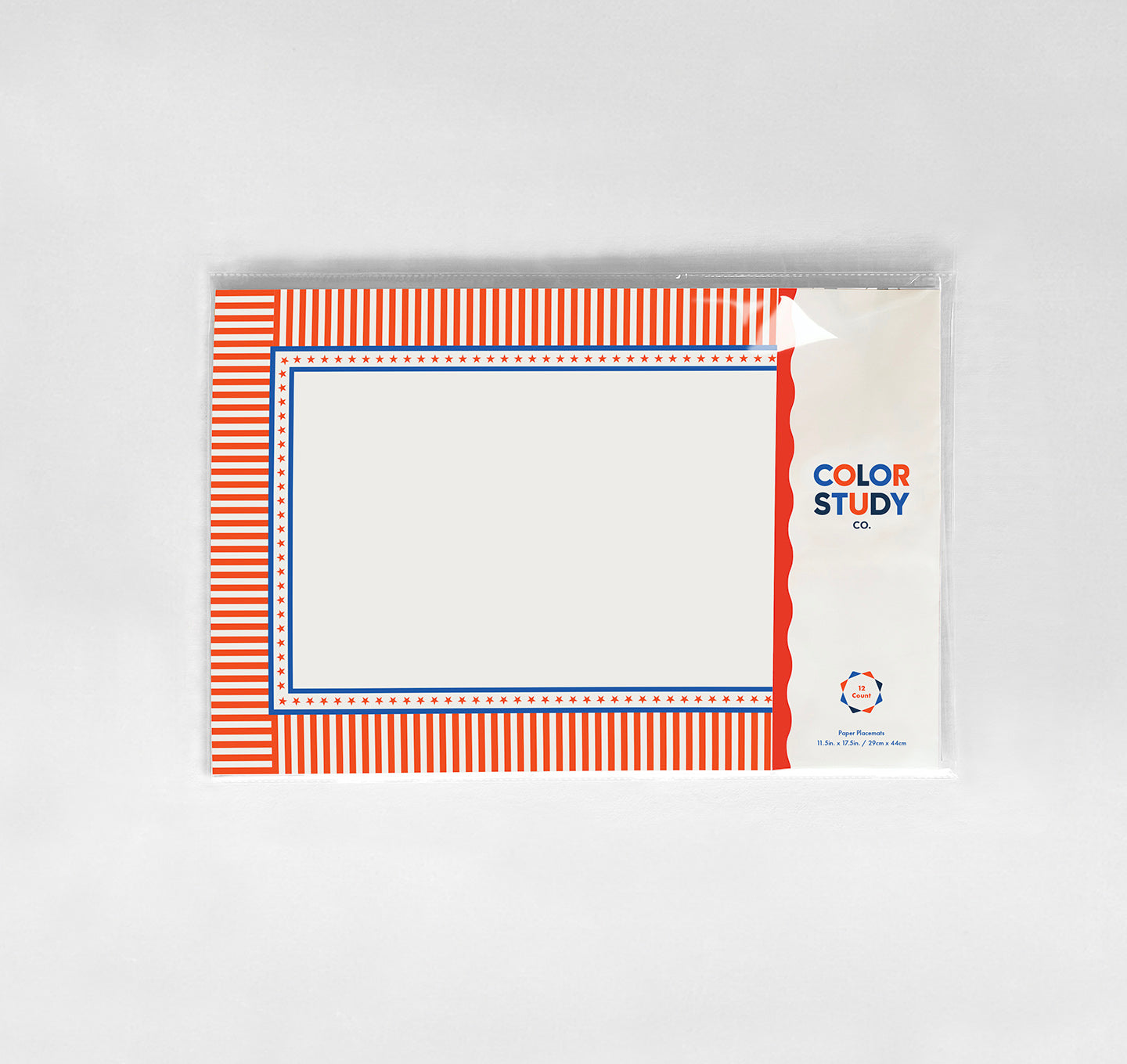 Color study paper placemats with red and blue stripes on a white background