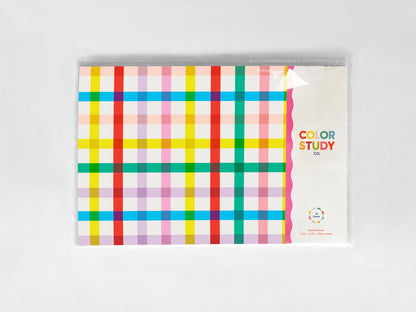 Colorful plaid paper placemat packaging with 'Color Study' text on a white background