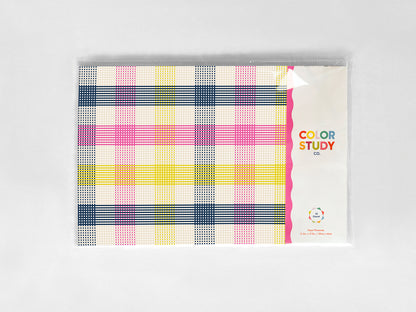 Color study packaging with plaid paper placemats and colorful text on a white background
