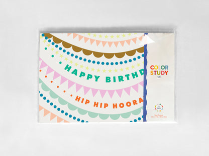 Colorful birthday paper placemat with decorative elements on a white background