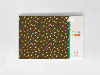 Paper placemats with colorful dot pattern on a white background
