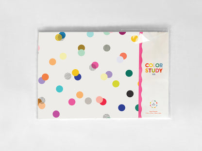 Color study paper placemat packaging  with colorful polka dots on a white background