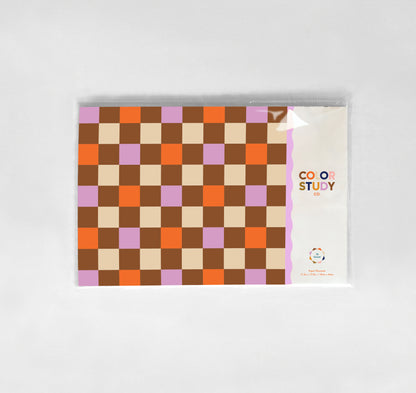 Checkered patterned placemat packaging with a visible brand name on a white background