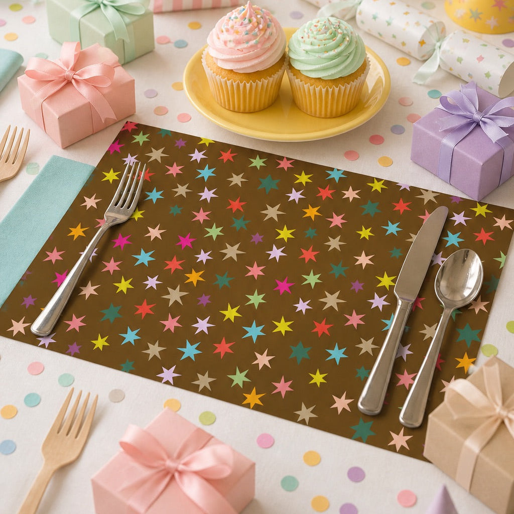 Brown paper placemat with colorful stars on a table set for a birthday party. 