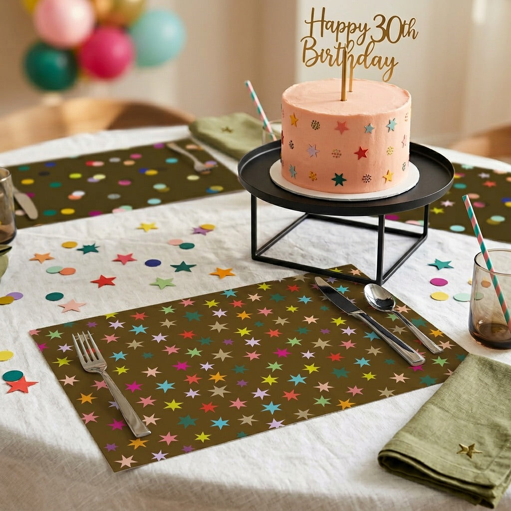 Brown paper placemat with colorful stars on a table set for a birthday. 